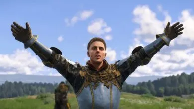Man in medieval armor with arms raised against a blue sky.