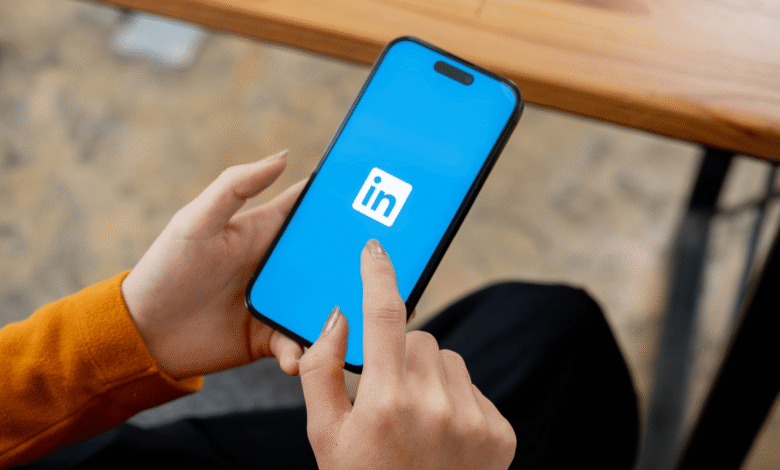 Person using LinkedIn app on a smartphone.