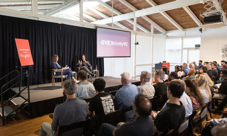 Two speakers on stage at a StrictlyVC event, audience in foreground.