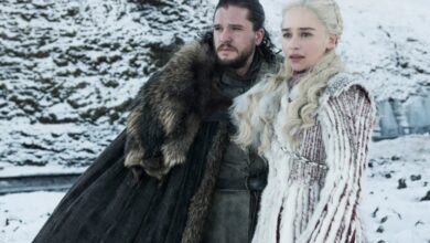 Jon Snow and Daenerys Targaryen stand in a snowy landscape.