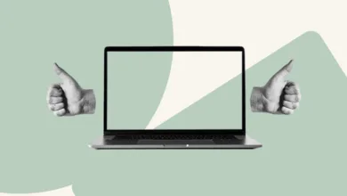 Laptop with thumbs up on a pastel green and beige background.