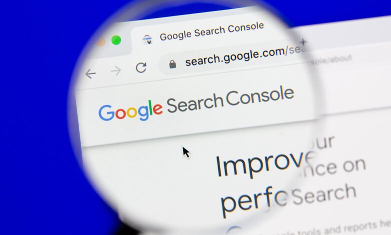 Google Search Console website interface seen through a magnifying glass.