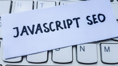 Close-up of keyboard with paper note reading 'Javascript SEO'.