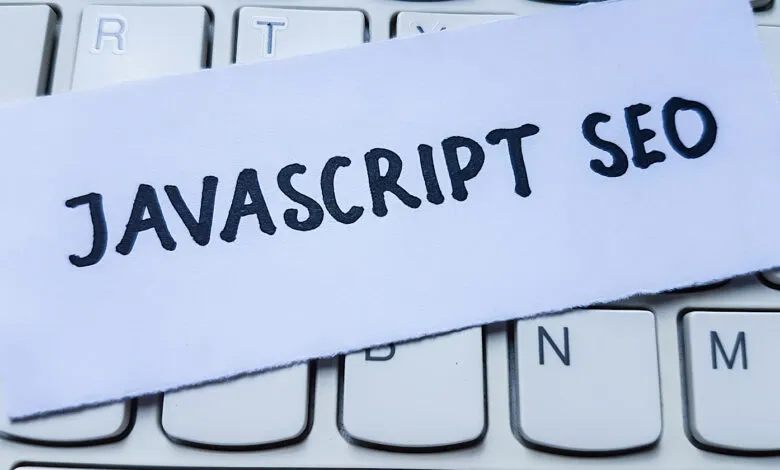 Close-up of keyboard with paper note reading 'Javascript SEO'.