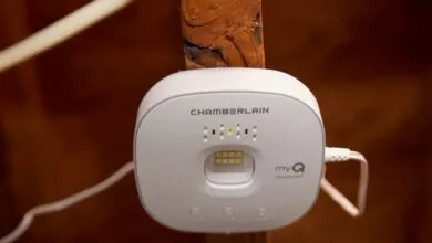 Chamberlain MyQ hub mounted on wooden beam, showing connected status.