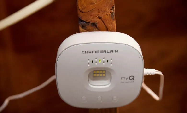 Chamberlain MyQ hub mounted on wooden beam, showing connected status.
