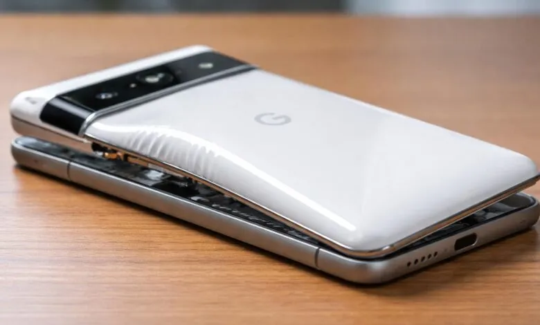 Google Pixel phone with swollen battery causing back panel to separate.