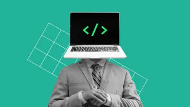 Person with laptop for head, code symbol on screen, wearing suit.