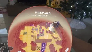 Augmented reality game shows a map with castles and forests, wave 8/11.