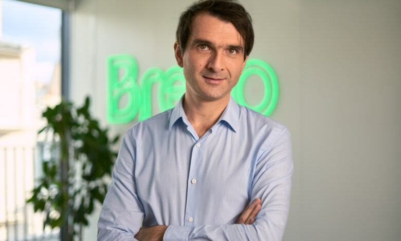 Armand Thiberge, Brevo CEO, poses with arms crossed in office.
