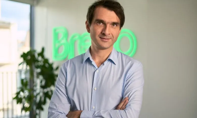 Armand Thiberge, Brevo CEO, poses with arms crossed in office.