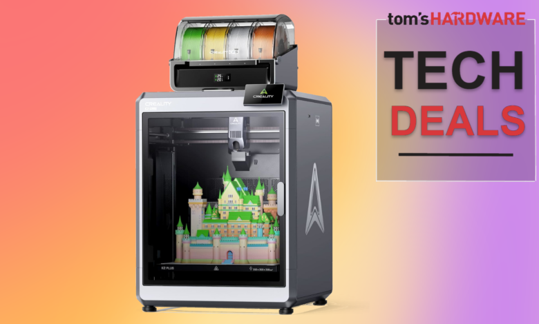 Creality K2 Plus 3D printer printing a colorful castle on a gradient background.