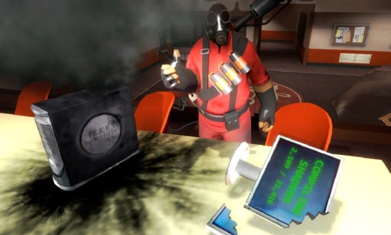 Team Fortress 2 Pyro gives thumbs up next to smoking computer.