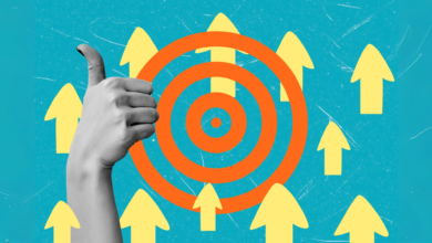 Hand giving thumbs up with target and arrows, symbolizing success.