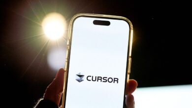Cursor app displayed on a smartphone screen held in hand.