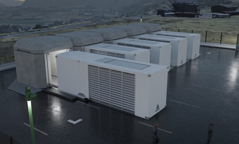 Row of white modular units with one open, on a wet surface, under a cloudy sky.