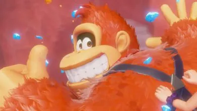 Donkey Kong smiles widely with gems floating around him, a joyful and vibrant scene.