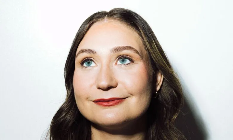 Close-up of Daniela Amodei looking up with a thoughtful expression.