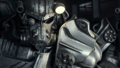 Close-up of Fallout Power Armor with a lit headlamp.