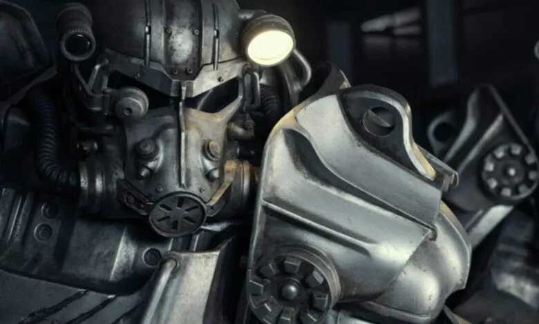 Close-up of Fallout Power Armor with a lit headlamp.