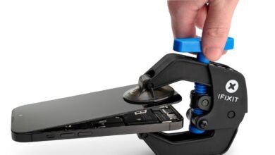 iPhone repair using iFixit tool to separate screen.