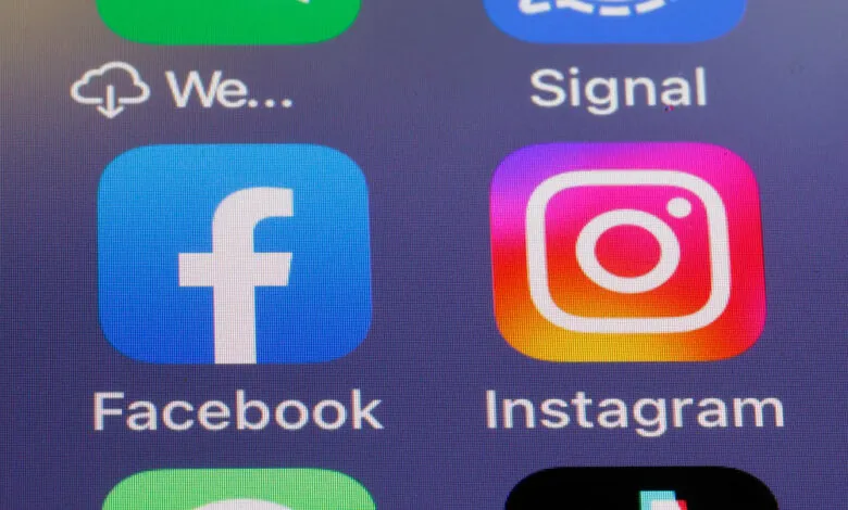 Close-up of Facebook and Instagram app icons on a phone screen.