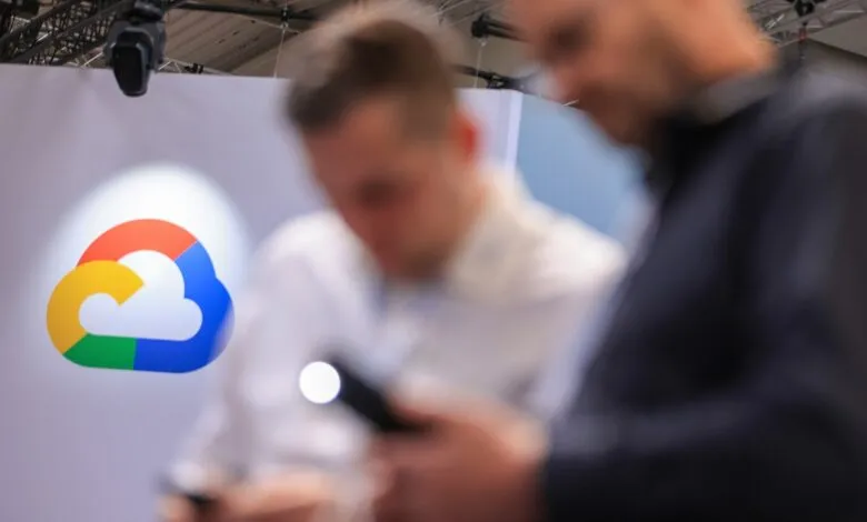 Google Cloud logo with two blurred people in the foreground.