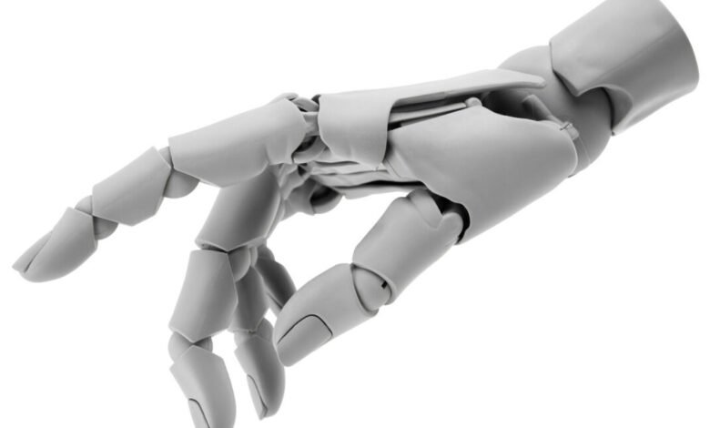 Articulated gray robot hand with visible joints against a white background.