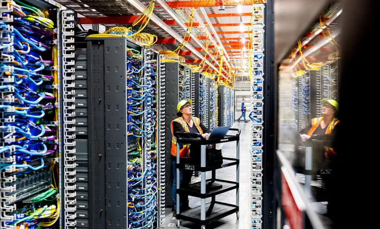 Technician works at an Amazon Web Services AI data center.