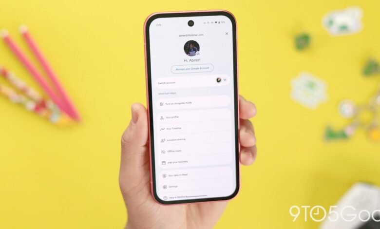 Hand holding phone displaying Google account page with profile details.