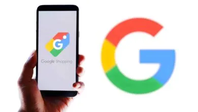 Hand holding phone displaying Google Shopping logo next to Google logo.
