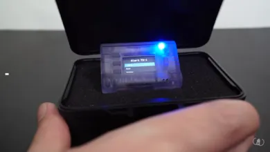 ESP32-based on-call pager, Alert TX-1, in a black protective case.