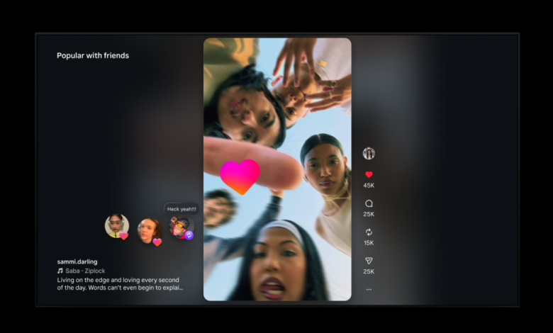 Social media reel of group of friends looking down at camera with heart overlay.