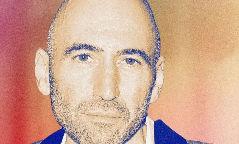 Close-up portrait of George Arison, CEO of Grindr, looking directly at the camera.