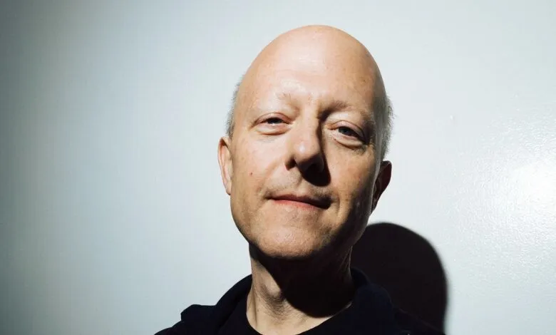 Close-up portrait of Jeremy Allaire against a white wall.