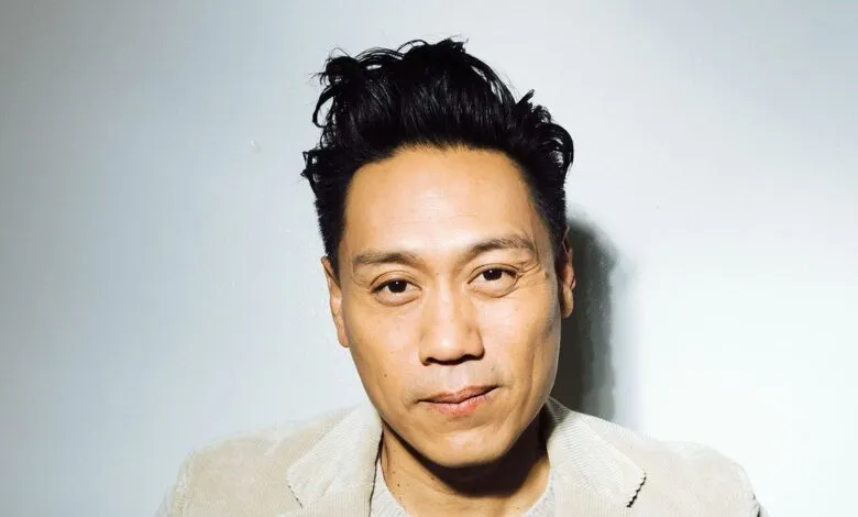 Close-up portrait of Jon M. Chu against a white background.