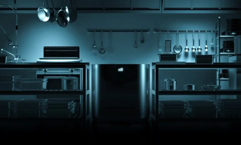 Mill food recycling bin in a professional kitchen setting.