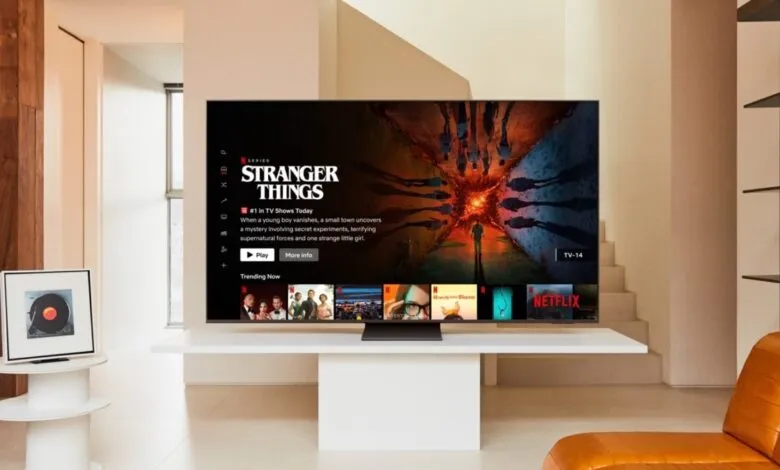 Samsung TV displaying Netflix's Stranger Things in a modern living room.