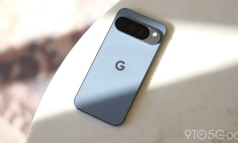 Light blue Google Pixel phone with camera bar on a marble surface.
