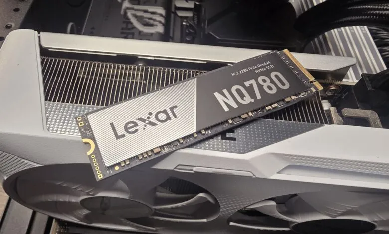 Lexar NQ780 NVMe SSD resting on a white computer component.