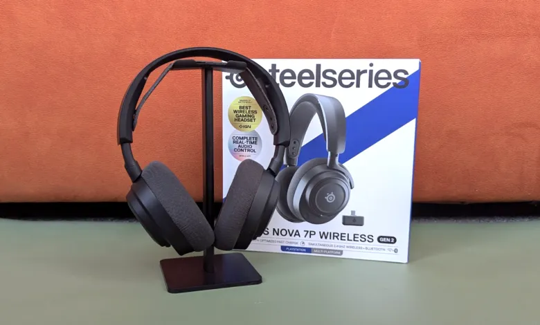 SteelSeries Nova 7P Wireless gaming headset on stand next to product box.