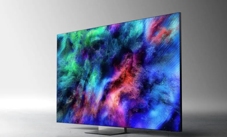 Modern flat screen TV displaying vibrant abstract art with green, blue, and red colors.