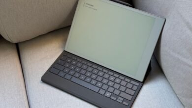 Remarkable 2 tablet with Type Folio keyboard case resting on a gray couch.