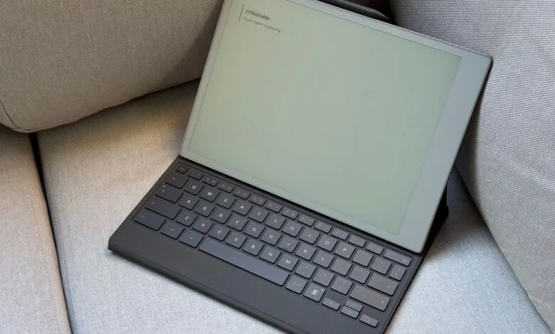 Remarkable 2 tablet with Type Folio keyboard case resting on a gray couch.
