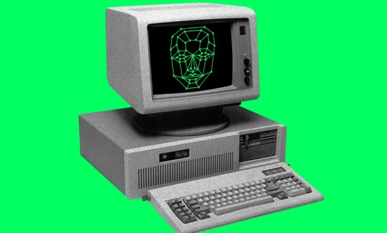 Vintage computer with green face recognition grid on the screen.