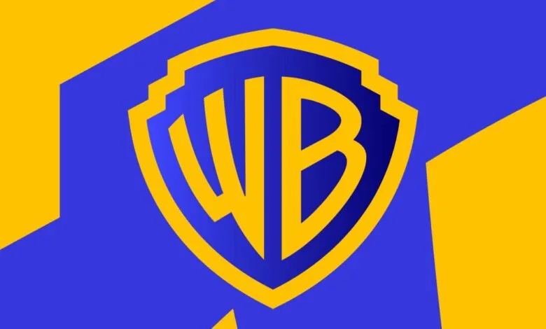 Warner Bros. logo in gold on a blue shield with a yellow background.