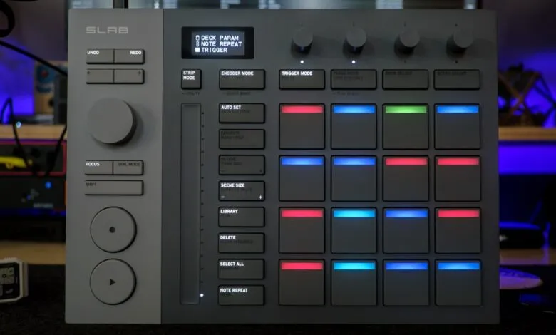 Serato Slab MIDI controller with illuminated pads and various control buttons.