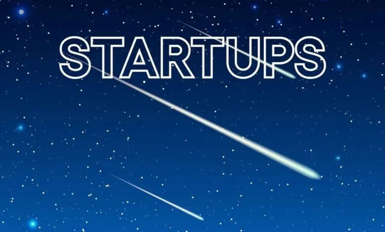 The word 'STARTUPS' with shooting stars on a dark blue starry background.