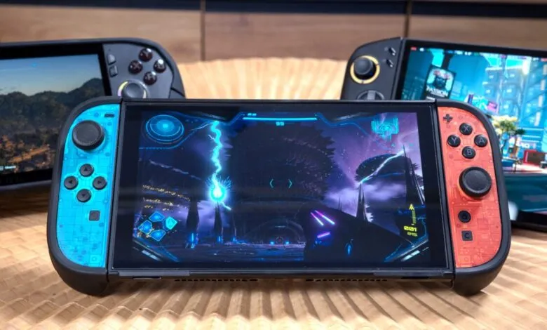 Three handheld gaming consoles displaying different game graphics.