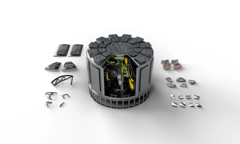 Exploded view of a complex, cylindrical machine with many parts.